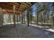Covered patio featuring stamped concrete and wooded view, perfect for outdoor entertaining and relaxing in nature at 4726 Pinon Dr, Elizabeth, CO 80107