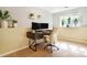 Functional home office setup with a desk, dual monitors, a comfortable chair, and natural light from the window at 482 Southpark Rd, Highlands Ranch, CO 80126