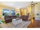 Bright living room with hardwood floors and views of the front yard at 482 Southpark Rd, Highlands Ranch, CO 80126