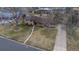 Aerial view of home showing the lot with grass and long driveway at 5982 S Aberdeen St, Littleton, CO 80120