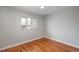 Bright bedroom features hardwood floors and natural light from one window at 5982 S Aberdeen St, Littleton, CO 80120