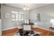 Dining area with hardwood floors, modern lighting, and a view of the yard at 5982 S Aberdeen St, Littleton, CO 80120