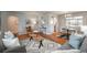 Cozy living room featuring hardwood floors, contemporary furniture, and ample natural light at 5982 S Aberdeen St, Littleton, CO 80120