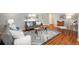 Inviting living room with hardwood floors, modern rug, and stylish furnishings at 5982 S Aberdeen St, Littleton, CO 80120