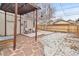 A backyard with a wooden deck and patio offers a private outdoor space for relaxation at 2377 Cherry St, Denver, CO 80207