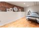 Basement bedroom with exposed brick and a spacious layout at 2377 Cherry St, Denver, CO 80207