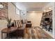 Finished basement with a comfortable seating area and unique decorative elements at 2377 Cherry St, Denver, CO 80207