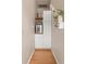 Charming butler's pantry featuring wood floors, custom cabinets, and shelving, ideal for storage and display at 2377 Cherry St, Denver, CO 80207