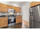 Functional kitchen with stainless steel appliances and granite countertops at 2377 Cherry St, Denver, CO 80207