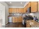 Well-equipped kitchen with stainless steel appliances and granite countertops at 2377 Cherry St, Denver, CO 80207