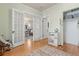 Bright and airy room with hardwood floors and access to other rooms at 2377 Cherry St, Denver, CO 80207
