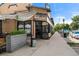 Charming building featuring a welcoming storefront with large windows, a stylish sign, and a sidewalk at 2377 Cherry St, Denver, CO 80207