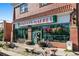 Inviting market storefront boasting brickwork, large windows, and colorful hanging flower baskets at 2377 Cherry St, Denver, CO 80207