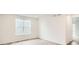 Bright, airy bedroom with wood-look flooring, a large window, and fresh paint at 641 Sunrise St, Erie, CO 80516