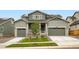 Charming two-story home with landscaped front yard and a two-car garage in a suburban neighborhood at 641 Sunrise St, Erie, CO 80516