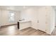Cozy kitchenette with a counter, sink, dark cabinets, and a white door for easy access at 641 Sunrise St, Erie, CO 80516