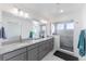 Spa-like bathroom with double sinks, a large shower, and modern finishes at 16508 E 111Th Pl, Commerce City, CO 80022