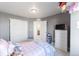 Cozy bedroom with a pink theme and built-in closet at 16508 E 111Th Pl, Commerce City, CO 80022