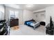 Basement bedroom with dresser and TV at 16508 E 111Th Pl, Commerce City, CO 80022