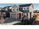 Two-story house with stone accents and a two-car garage at 16508 E 111Th Pl, Commerce City, CO 80022