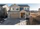 Two-story house with stone accents and a two-car garage at 16508 E 111Th Pl, Commerce City, CO 80022