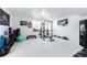 Finished basement home gym with various equipment at 16508 E 111Th Pl, Commerce City, CO 80022