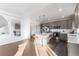 Modern kitchen with gray cabinets, stainless steel appliances, and an island at 16508 E 111Th Pl, Commerce City, CO 80022