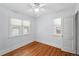 Bright, well-lit bedroom with two windows and beautiful hardwood flooring at 2549 Holly St, Denver, CO 80207