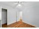 Bedroom with hardwood floors, closet, and neutral paint at 2549 Holly St, Denver, CO 80207