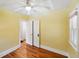 Sunny bedroom with hardwood floors, two windows and a closet at 2549 Holly St, Denver, CO 80207