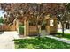 Inviting brick home with front porch and mature trees, enhancing its curb appeal at 2549 Holly St, Denver, CO 80207