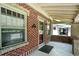 Exterior view of the brick front porch with address on the door at 2549 Holly St, Denver, CO 80207