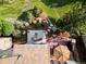 Aerial view of beautiful backyard with a stone patio, fire pit, lounge area and manicured landscaping at 5149 Le Duc Ln, Castle Rock, CO 80108
