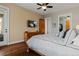 Well lit bedroom with a television, sliding door to patio, and ensuite bathroom access at 5149 Le Duc Ln, Castle Rock, CO 80108