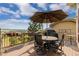 Outdoor deck with a dining set, umbrella, and beautiful panoramic view of the mountains at 5149 Le Duc Ln, Castle Rock, CO 80108