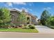 Beautiful home featuring a stone facade, manicured landscaping, and a long driveway at 5149 Le Duc Ln, Castle Rock, CO 80108