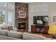 Cozy fireplace area with a stone surround, perfect for chilly evenings at 5149 Le Duc Ln, Castle Rock, CO 80108