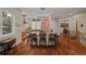 Spacious kitchen with hardwood floors, a large island with seating, and modern lighting at 5149 Le Duc Ln, Castle Rock, CO 80108