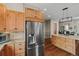 Stainless steel refrigerator is in this wooden kitchen at 5149 Le Duc Ln, Castle Rock, CO 80108