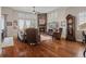 Spacious living room boasts a stone fireplace, ample seating, and abundant natural light at 5149 Le Duc Ln, Castle Rock, CO 80108