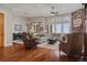 Living room features hardwood flooring, stone fireplace, and open concept design at 5149 Le Duc Ln, Castle Rock, CO 80108