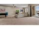 Spacious carpeted living room with a couch, pool table, and access to the patio at 5149 Le Duc Ln, Castle Rock, CO 80108