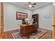 Office space featuring a wooden desk, ceiling fan, a decorative rug, and bookcase at 5149 Le Duc Ln, Castle Rock, CO 80108