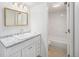 Bathroom with white vanity, granite countertop, and a shower-tub combo with tile surround at 9700 E Iliff Ave # B13, Denver, CO 80231
