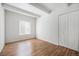 Comfortable bedroom features wood-look floors, white walls, and closet for storage at 9700 E Iliff Ave # B13, Denver, CO 80231