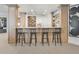 Basement bar with a white countertop, four black bar stools, wood paneling, and displayed liquor shelves at 2130 Avenida Del Sol, Castle Rock, CO 80104
