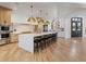 Modern kitchen with a large center island, stainless steel appliances, and a sleek design perfect for culinary enthusiasts at 2130 Avenida Del Sol, Castle Rock, CO 80104