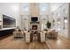 Spacious living room featuring vaulted ceilings, a stone fireplace, and large windows for natural light at 2130 Avenida Del Sol, Castle Rock, CO 80104