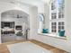 Open concept living room with vaulted ceilings, large windows, and a window seat at 2130 Avenida Del Sol, Castle Rock, CO 80104
