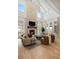 Bright living room with a stone fireplace, vaulted ceilings, hardwood floors, and ample natural light at 2130 Avenida Del Sol, Castle Rock, CO 80104
